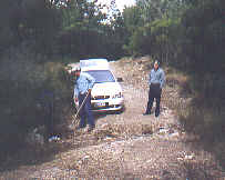 Vito fills in a washout so we can drive to the crash site