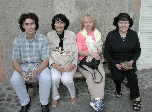 Jacopo, Chiara, Teddie, and Primina in front of the Farmacia