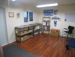 Only one window. The other walls face a hangar wall.